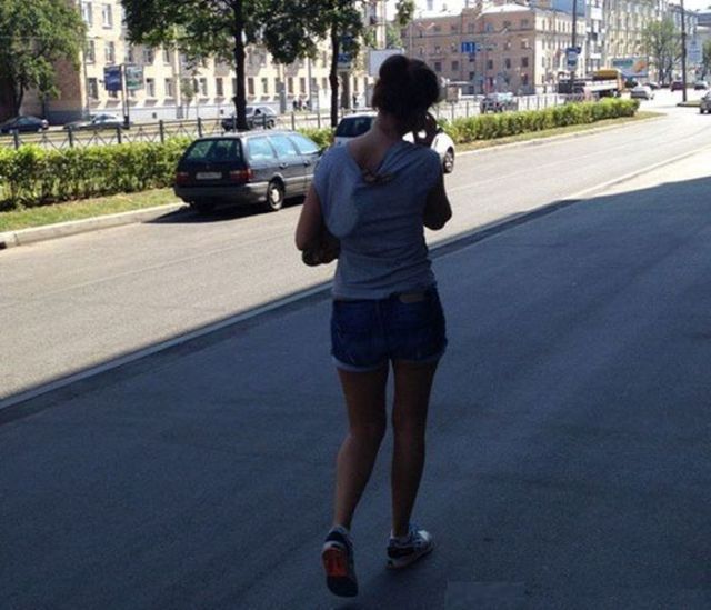 walking on the street with a snake Terrifying she left the house with the snake on her back!